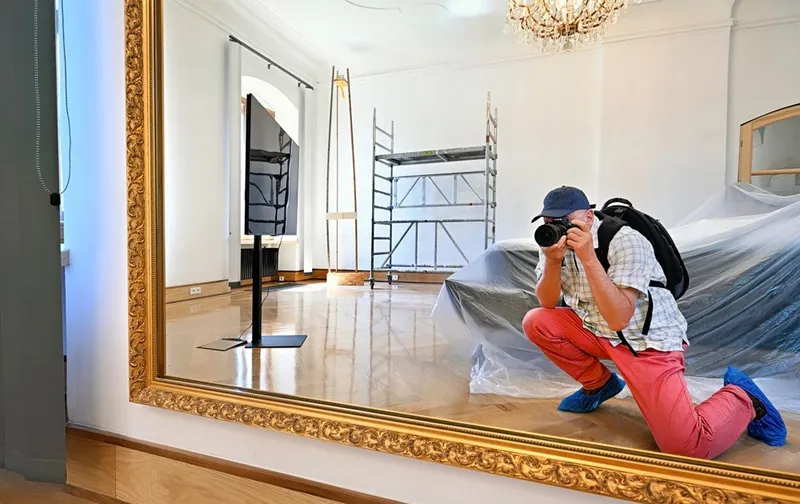 Der Fotograf im Schlafzimmer-Spiegel